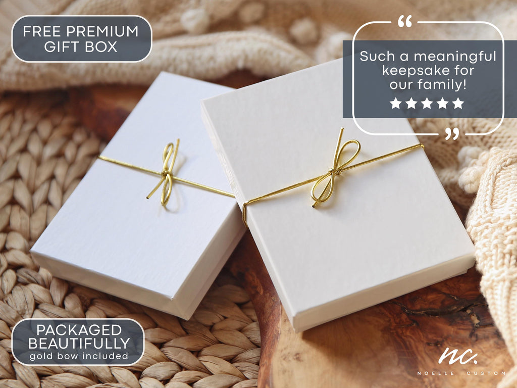May include: Two rectangular white gift boxes, each tied with a thin gold metallic string in a bow. The boxes feature a textured surface and are presented together. Text on the image includes "FREE PREMIUM GIFT BOX" and "PACKAGED BEAUTIFULLY".