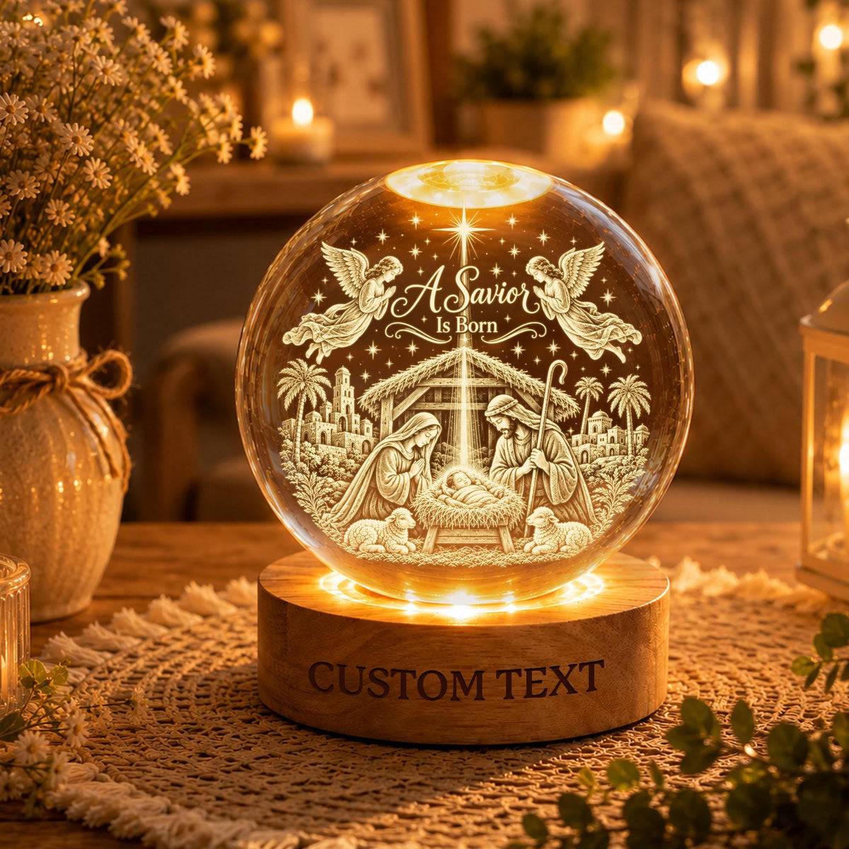 May include: A clear glass sphere featuring an etched nativity scene with the text A Savior Is Born, illuminated by a light-up wooden base with the words CUSTOM TEXT engraved on the front, displaying figures of Mary, Joseph, and the infant Jesus.