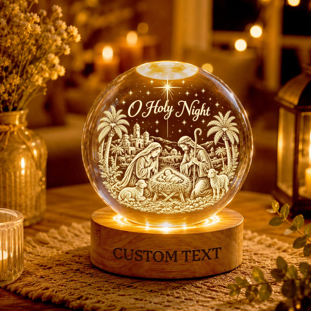 May include: A clear glass sphere featuring an etched nativity scene with the text O Holy Night, resting on a circular wooden base with the engraved text CUSTOM TEXT. The sphere displays figures of Mary, Joseph, and a baby in a manger with palm trees.