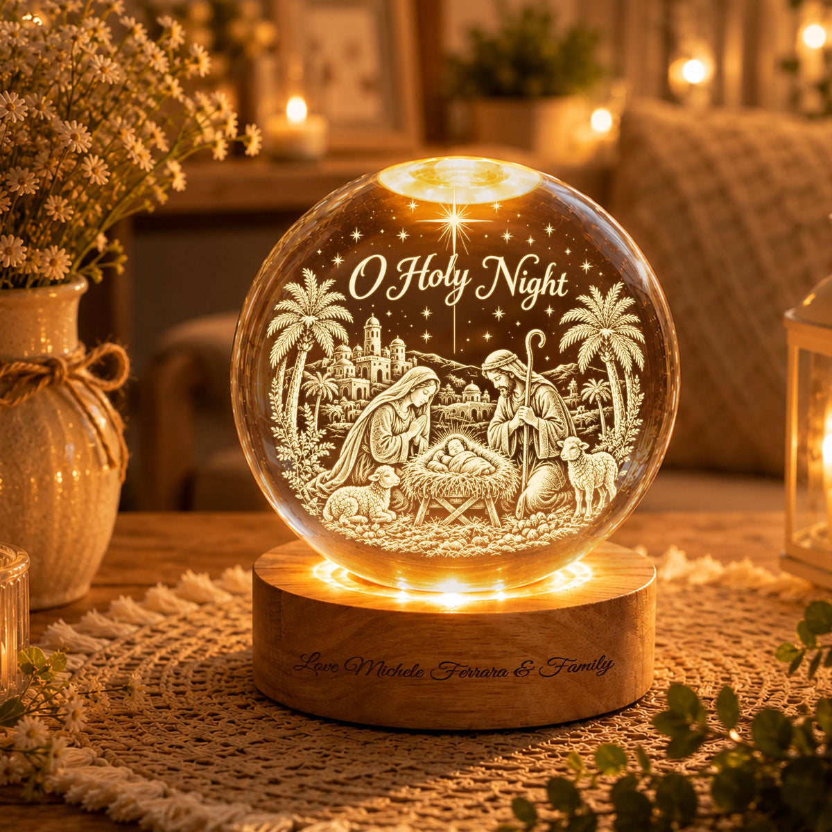 May include: A spherical glass night light featuring an etched nativity scene with the text O Holy Night, illuminated from a circular wooden base engraved with the text Love Michele Ferrara & Family, displaying figures of Mary, Joseph, and a baby.