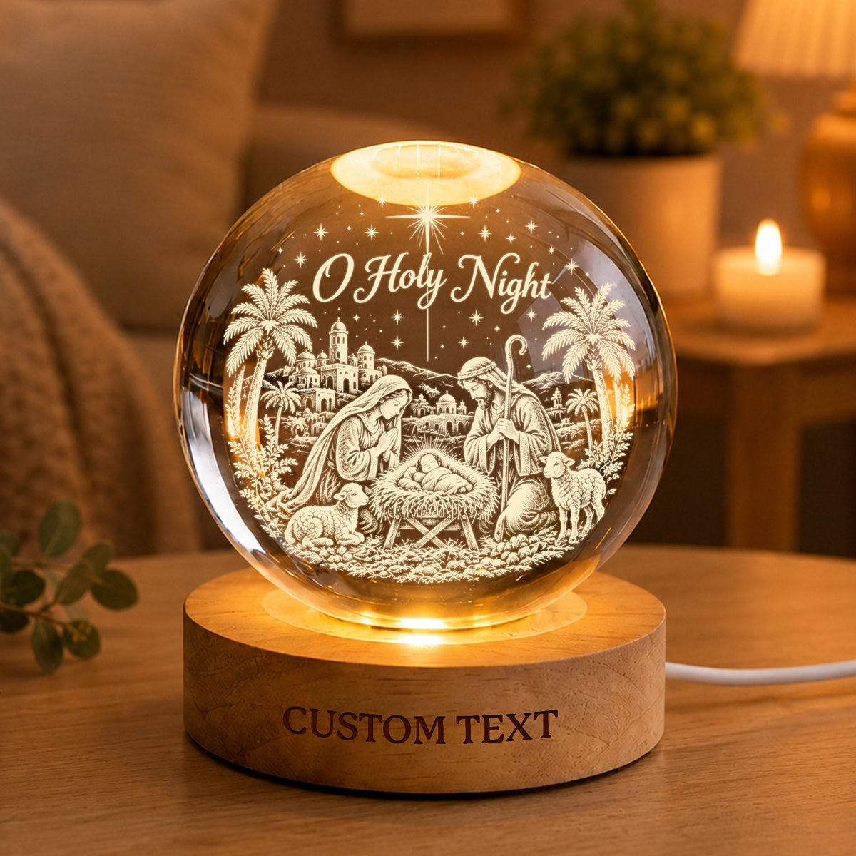 May include: A spherical glass ornament featuring an etched nativity scene with the text O Holy Night, illuminated from below by a circular wooden base with the words CUSTOM TEXT engraved on the front, creating a warm glowing display piece.