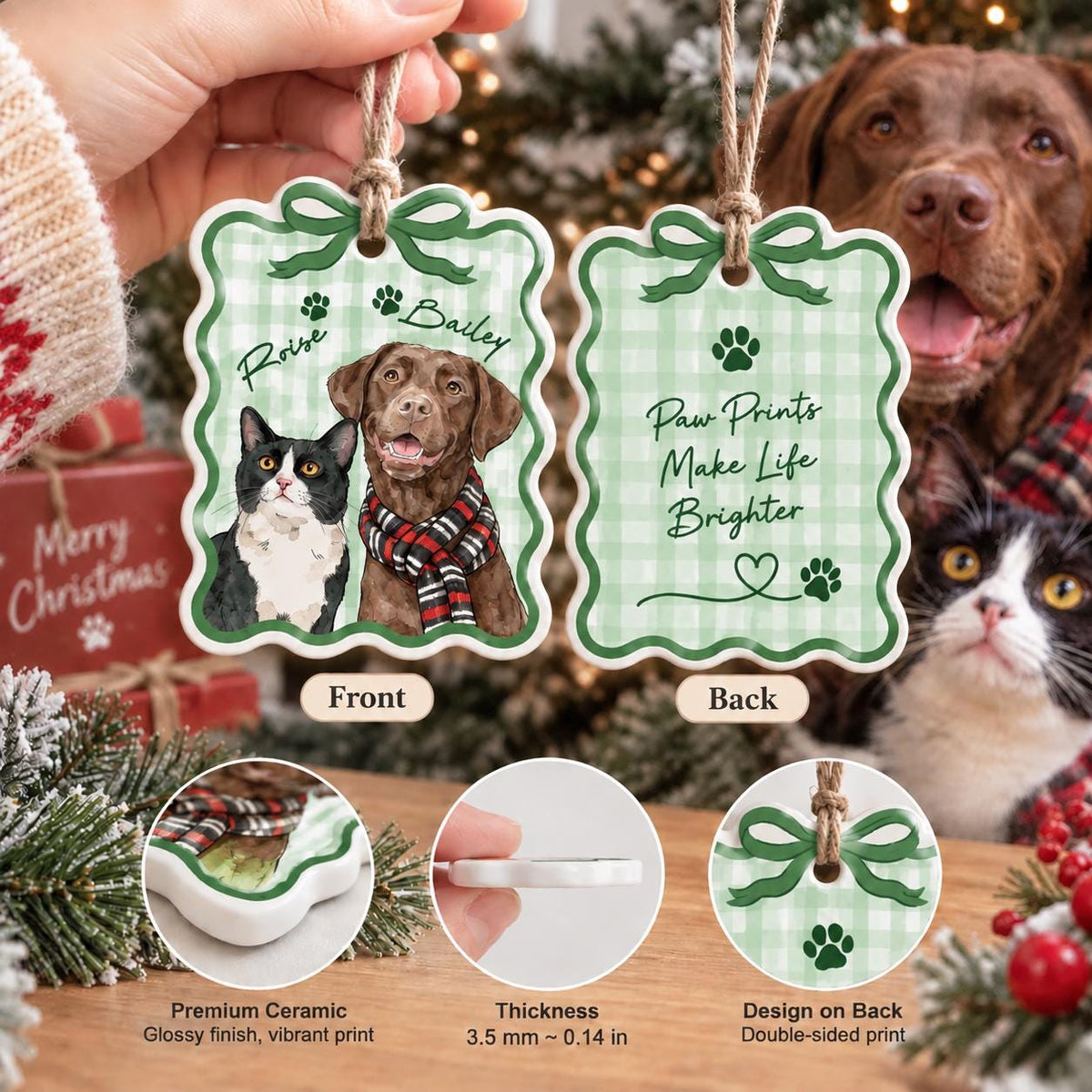 May include: A scalloped ceramic ornament with a green gingham pattern. The front features a cat and a brown dog wearing a red and black scarf with the names Roise and Bailey. The back displays the text Paw Prints Make Life Brighter with paw prints and a heart. It is 3.5 mm thick.