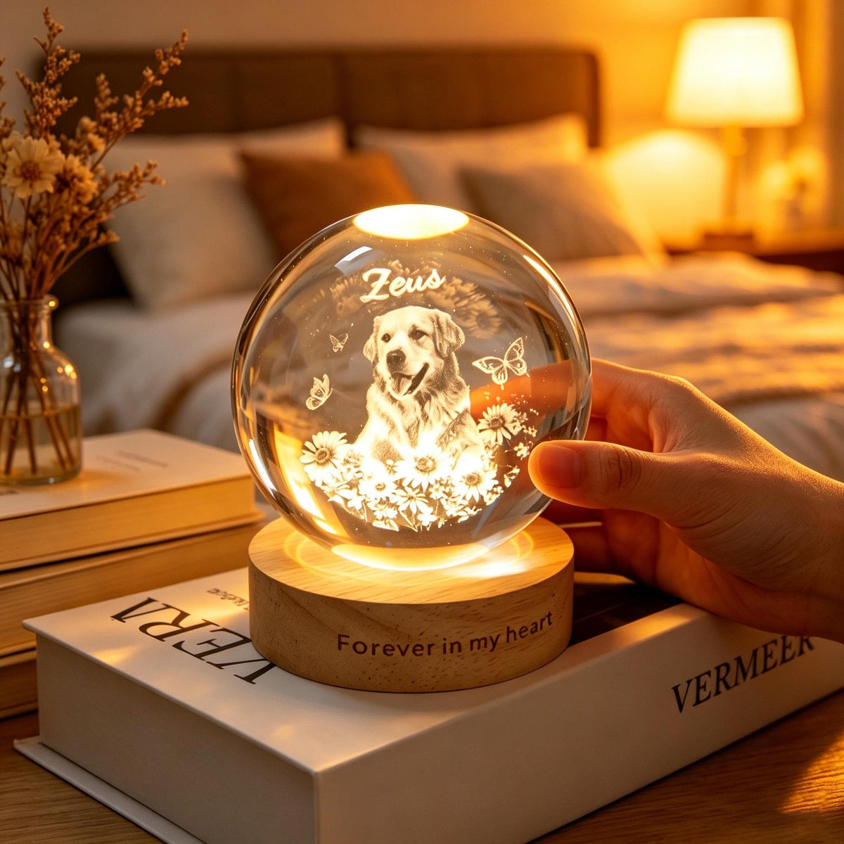 May include: A glowing crystal ball with a dog portrait, butterflies, and flowers, resting on a wooden base. The base reads "Forever in my heart." The crystal ball is lit from within, creating a warm, inviting glow. The dog's name, "Zeus," is etched on the crystal.