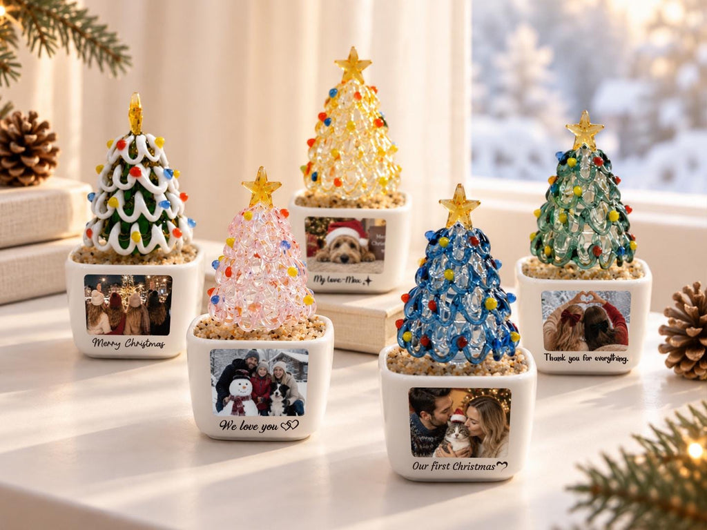 May include: Five miniature Christmas tree ornaments in white square ceramic pots. Each tree is made of colorful glass beads with a gold star topper. The pots feature custom printed photographs and text including Merry Christmas and We love you.