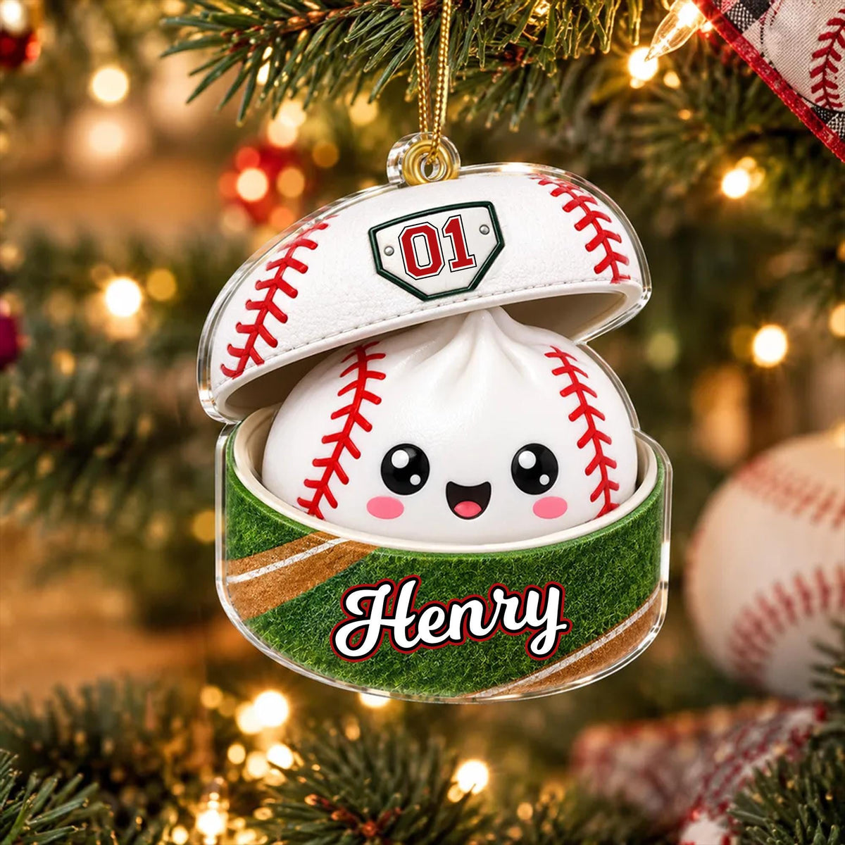 A personalized baseball ornament with the name "Henry" on it, hanging from a Christmas tree.