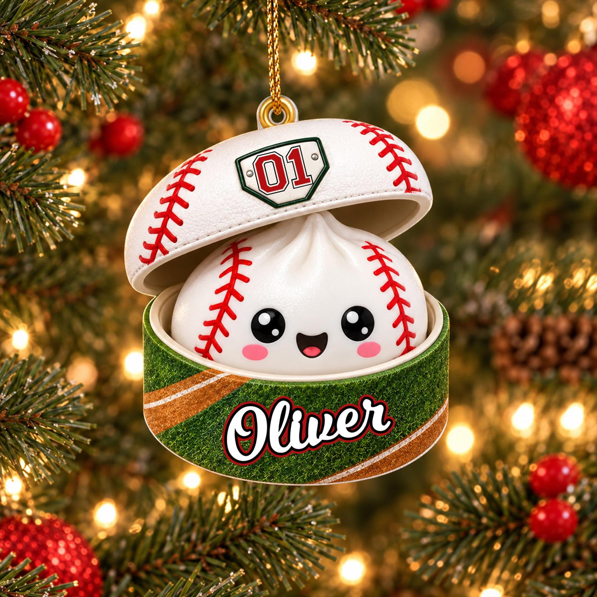 A white baseball with red stitching is hanging from a Christmas tree ornament, which has a face and the name "Olivier" written on it.