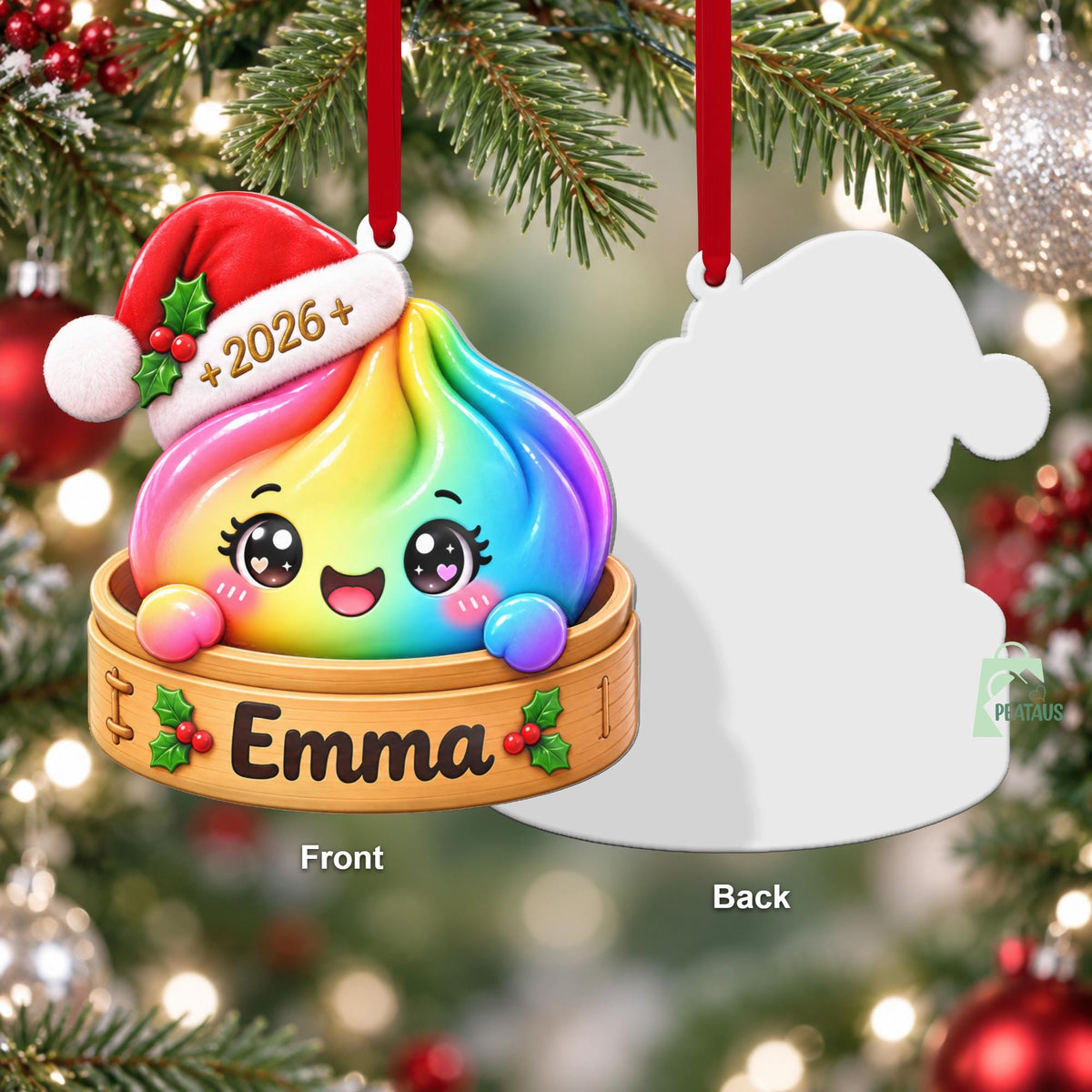 May include: A Christmas ornament featuring a rainbow-colored dumpling character wearing a red Santa hat with the text 2026. The character sits in a wooden steamer basket labeled with the name Emma and decorated with green holly and red berries.