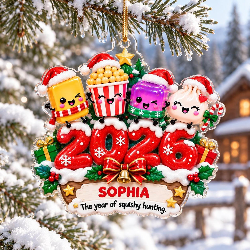 May include: A Christmas ornament featuring four cartoon characters wearing Santa hats above the red numbers 2026. The base displays the name SOPHIA and the text The year of squishy hunting. The design includes green holly leaves, red berries, and a gold bow.