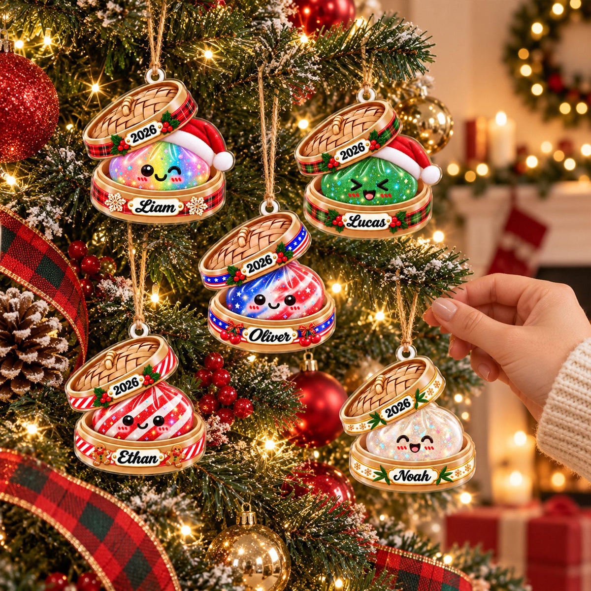 May include: Five round Christmas ornaments shaped like bamboo steamers, each containing a colorful character wearing a Santa hat. The ornaments feature the year 2026 and the names Liam, Lucas, Oliver, Ethan, and Noah printed on the base.