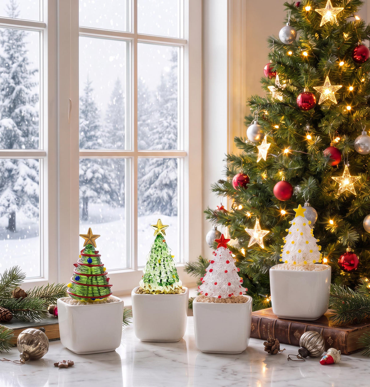 May include: Four miniature decorative Christmas trees in white square ceramic pots. Each tree features a unique glass design with colorful accents and a star topper, displayed on a surface with pine branches and vintage ornaments.