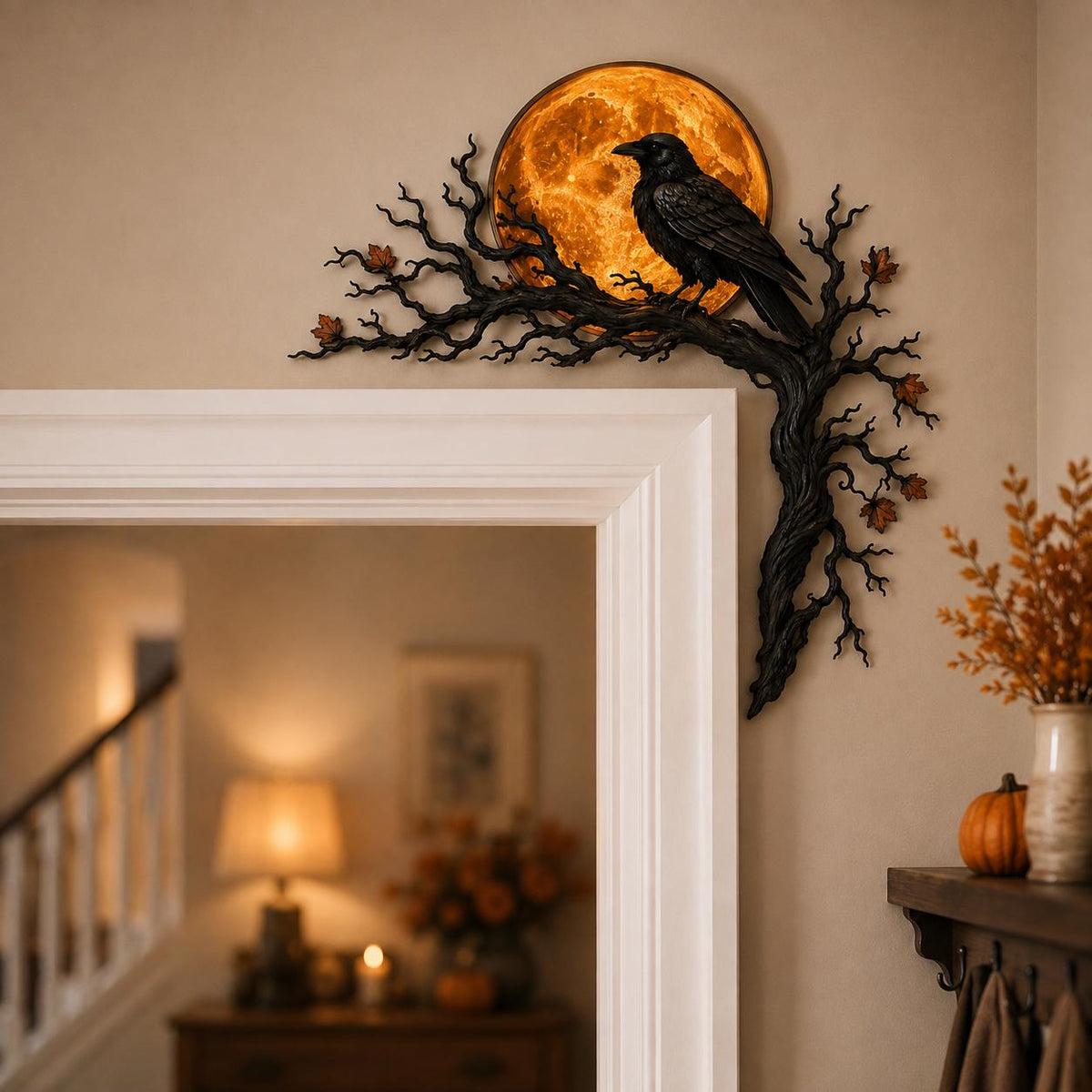 May include: A black raven perched on a dark, gnarled tree branch that extends along the corner of a door frame. Behind the bird is a circular, glowing orange moon. Small, scattered brown leaves are attached to the textured, winding branches.