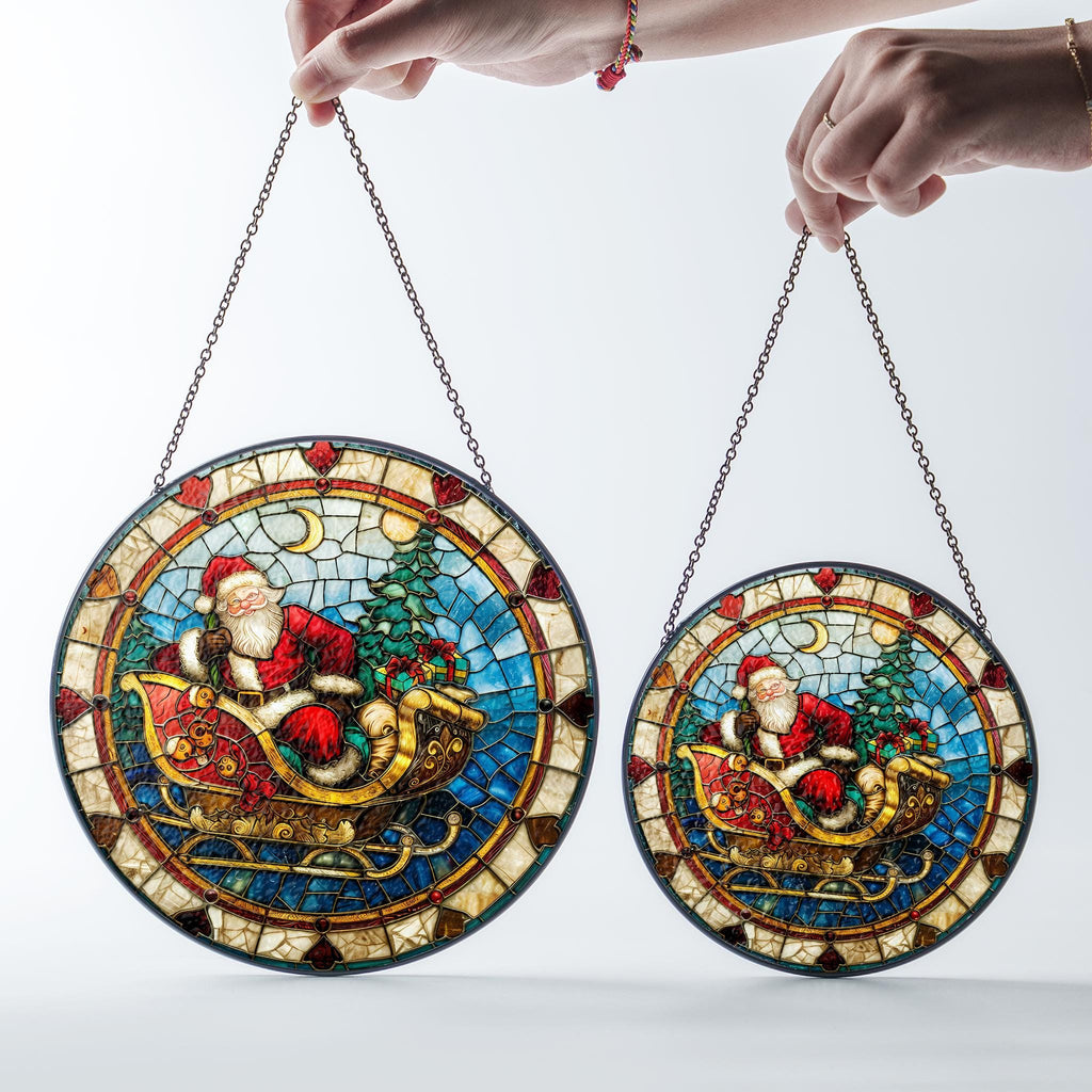May include: Two round stained glass window hangings featuring Santa Claus in a sleigh with a Christmas tree and presents. The larger hanging is 12 inches in diameter and the smaller hanging is 8 inches in diameter.