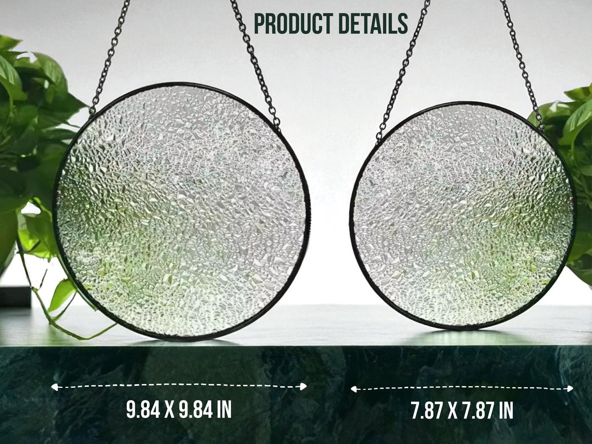 May include: Two circular stained glass suncatchers with black metal frames and hanging chains. The glass features a textured, clear-to-green gradient finish. Text indicates dimensions of 9.84 x 9.84 inches and 7.87 x 7.87 inches for the two pieces.