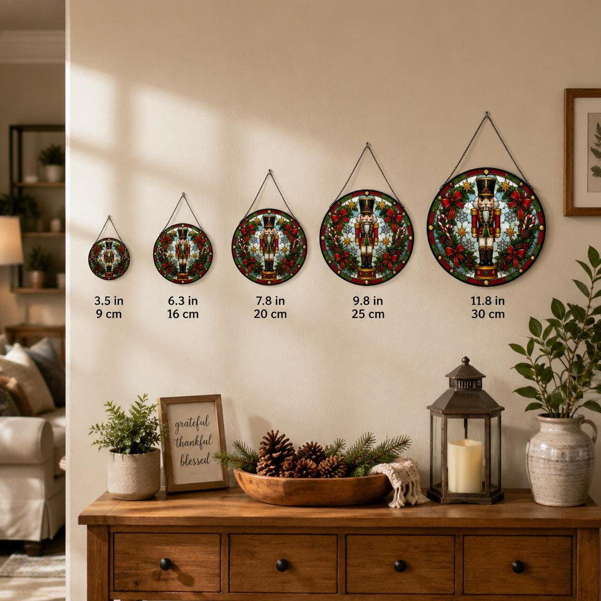 Nutcracker stained glass suncatcher size comparison showing five round wall hangings from 3.5 inches to 11.8 inches.