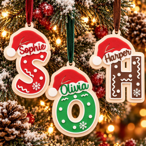 May include: Three personalized letter ornaments shaped as S, O, and H, each topped with a red Santa hat. The S is red with white dots and a snowflake, the O is green with white dots and a snowflake, and the H is brown with white dots and a snowflake.