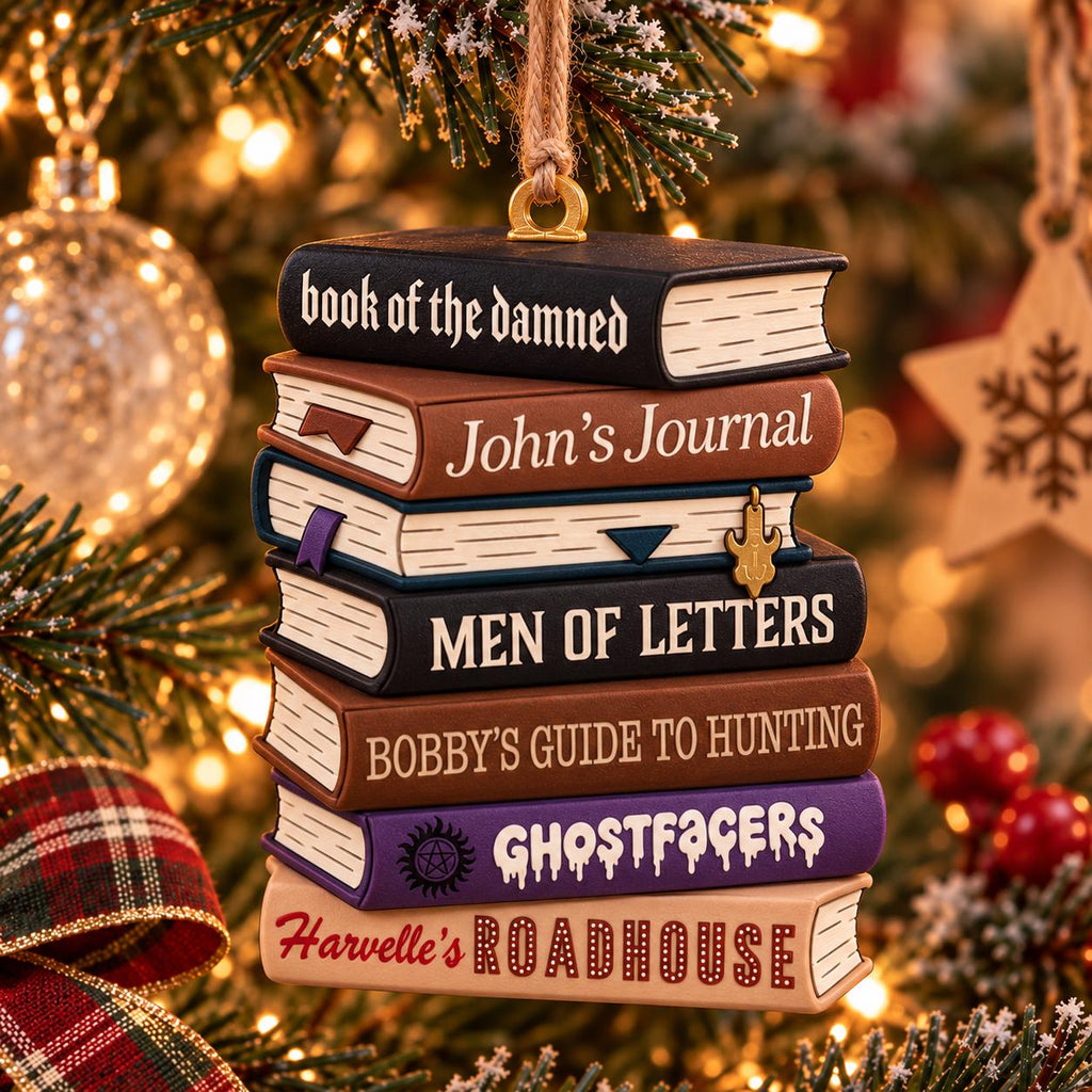 May include: A hanging Christmas tree ornament featuring a stack of six miniature books. The spines are labeled: book of the damned, John's Journal, MEN OF LETTERS, BOBBY'S GUIDE TO HUNTING, GHOSTFACERS, and Harvelle's ROADHOUSE, with a small metal charm.