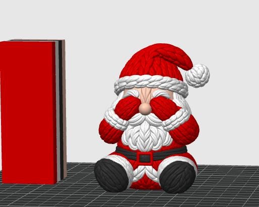 May include: A Santa Claus figurine with a textured, knit-like appearance, wearing a red hat with a white pom-pom and trim, a red coat, a black belt with a buckle, and black boots. The figure has its hands covering its eyes and a white beard.