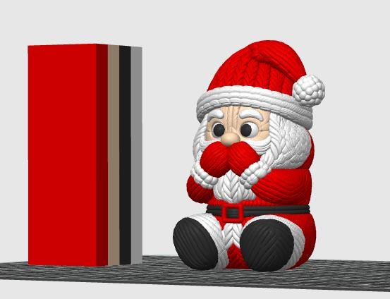May include: A Santa Claus figurine with a textured knit-like surface, wearing a red hat with a white pom-pom, a red coat with a black belt, and black boots. Beside the figure stands a tall, rectangular block featuring vertical stripes of red, tan, black, and gray.