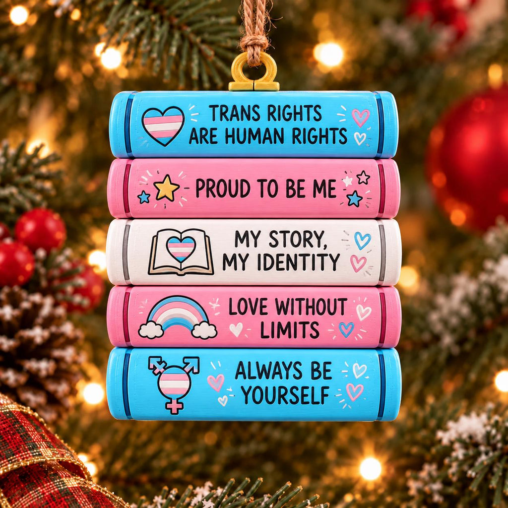 May include: A stack of five rectangular ornaments hanging from a string. The blocks feature the text: Trans Rights Are Human Rights, Proud To Be Me, My Story My Identity, Love Without Limits, and Always Be Yourself with colorful icons.