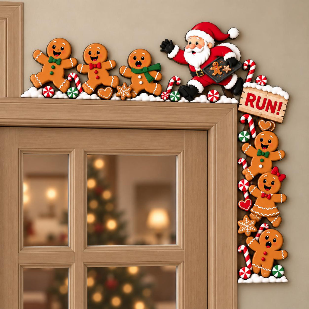 May include: A decorative door corner sign featuring Santa Claus and multiple gingerbread figures. Santa holds a tray with a cookie, while gingerbread characters are arranged along the frame. A sign with the text RUN! is included.