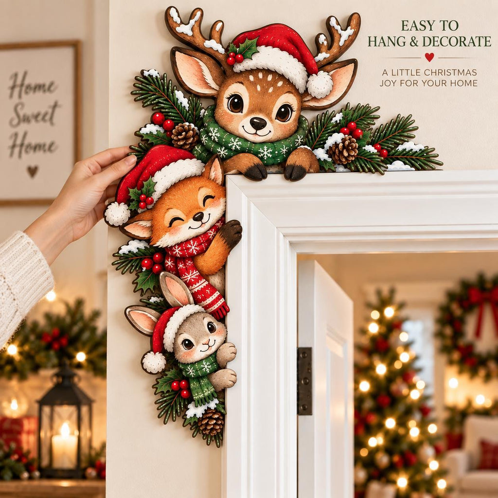 May include: A decorative wooden door corner sign featuring a reindeer, a fox, and a rabbit wearing Santa hats and scarves, accented with pine branches, red berries, and pinecones. The text reads: EASY TO HANG & DECORATE A LITTLE CHRISTMAS JOY FOR YOUR HOME.